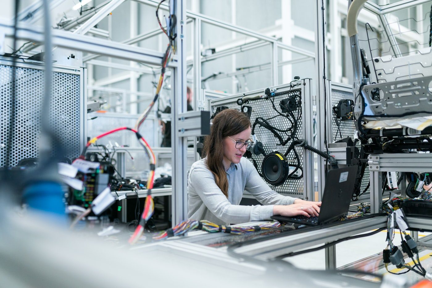 An engineer working beside industrial equipment