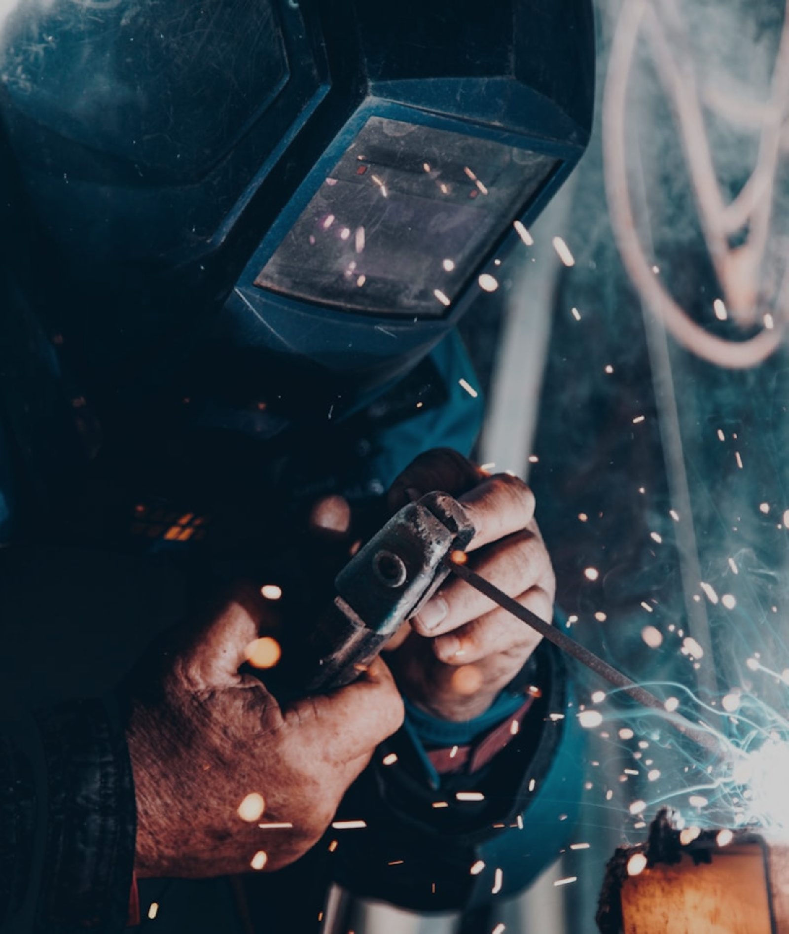 An industrial welding site with sparks flying